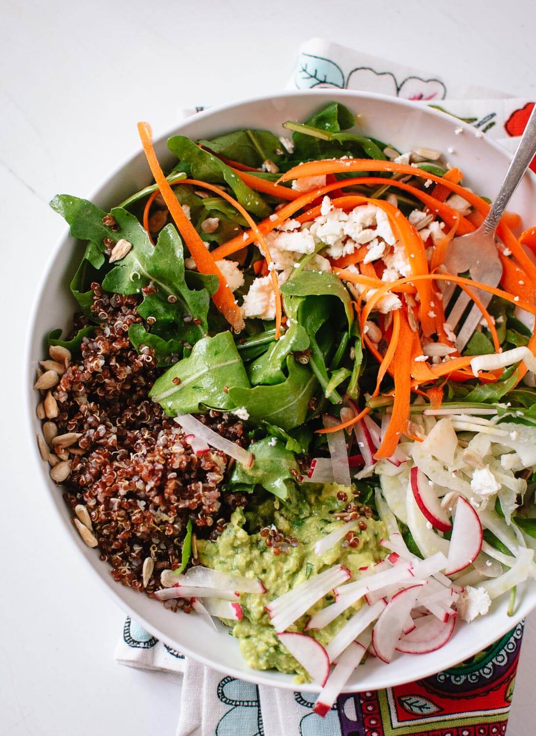 A fresh and filling spring salad, featuring arugula, carrots, quinoa and avocado - cookieandkate.com
